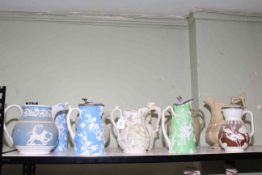 Collection of ten Victorian stoneware and Parian relief moulded jugs; subjects including fish,