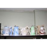 Collection of ten Victorian stoneware and Parian relief moulded jugs; subjects including fish,