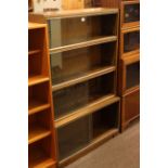 Oak four height sliding glazed door stacking bookcase, 89cm by 140cm.