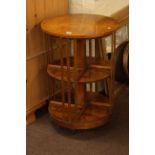 Burr wood circular revolving two tier bookcase, 53cm diameter by 77cm.