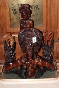 Nine Eastern wood carvings including pair of lions, bust and figures.