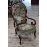 Victorian mahogany framed scroll armchair in needlework fabric.