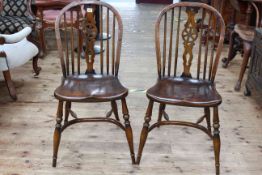 Set of four wheelback dining chairs with crinoline stretchers.