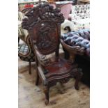 Oriental hardwood high back open armchair carved with dragons.