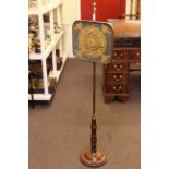 Regency mahogany and brass adjustable pole screen with needlework panel.