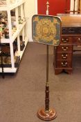 Regency mahogany and brass adjustable pole screen with needlework panel.