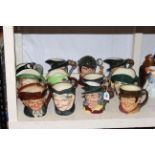 Twelve large Beswick and Royal Doulton character jugs including Pied Piper, Long John Silver.