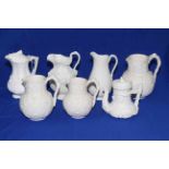 Cobridge Albion set of three relief moulded jugs, together with three Parian jugs and teapot (7).