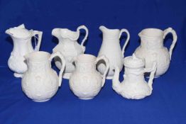 Cobridge Albion set of three relief moulded jugs, together with three Parian jugs and teapot (7).