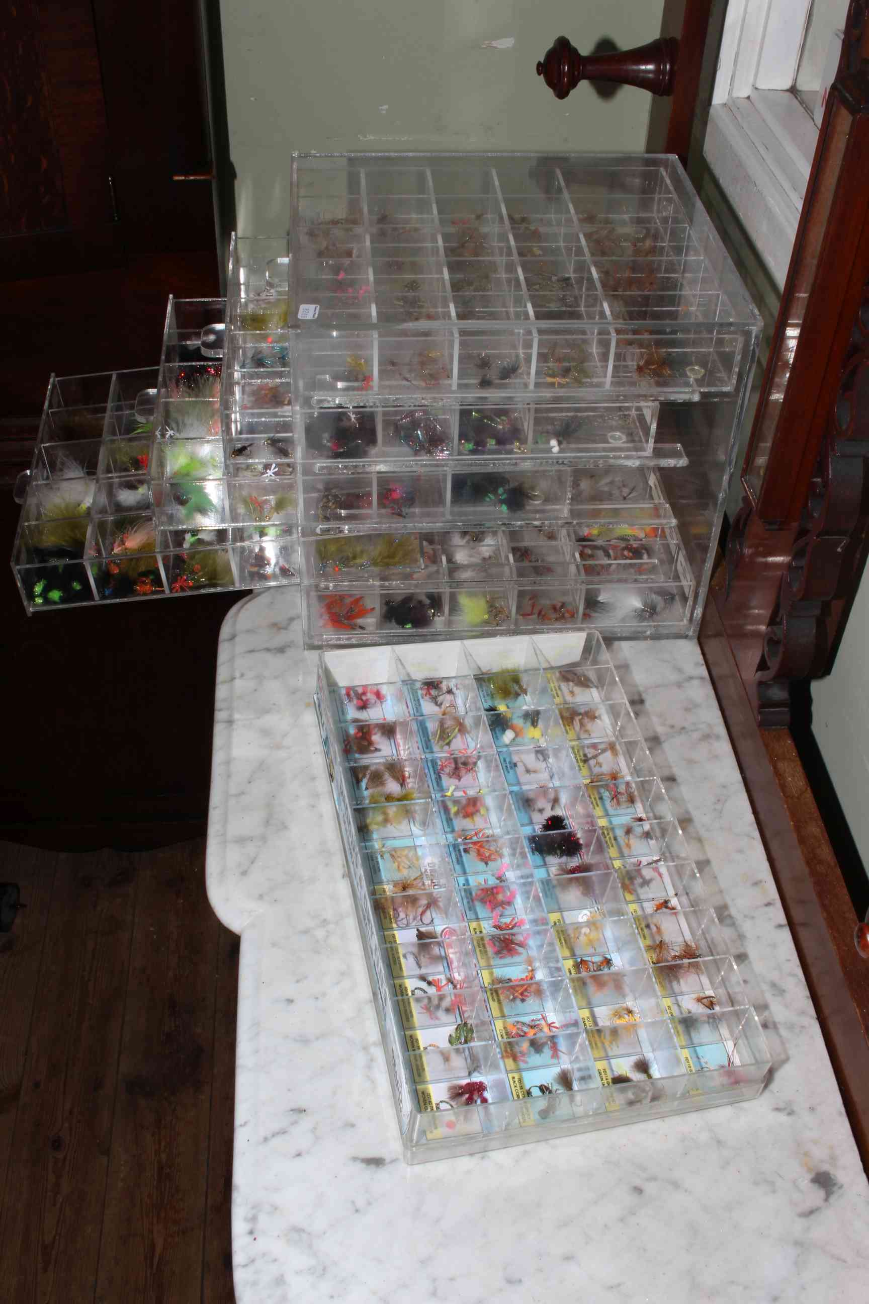 Two fly fishing perspex cabinets with approximately 1500 flies.