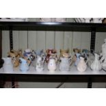 Collection of twenty one Victorian mostly relief moulded jugs, various factories,