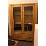 Contemporary light display cabinet having two glazed panel doors above two long drawers 129cm by