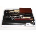 Tray lot with cased veneer scale measure, boxed drawing instruments, ivory rules, sugar cutters,