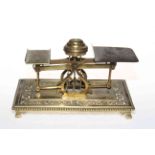 Late Victorian brass postal scales having ornate pierced base with bead border.