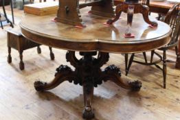 Victorian mahogany shaped oval top loo table on four carved and scrolled central supports to four