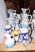 Collection of ten Victorian relief moulded jugs and one mug,