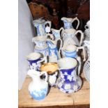 Collection of ten Victorian relief moulded jugs and one mug,