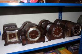 Eleven oak vintage mantel clocks.