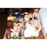 Collection of decorative china including two German dolls, Nat West pigs, Wade Whimsies,