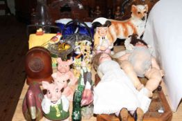 Collection of decorative china including two German dolls, Nat West pigs, Wade Whimsies,