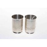 Pair silver beakers, each having band of embossed foliage, 9cm.