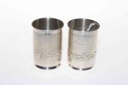 Pair silver beakers, each having band of embossed foliage, 9cm.