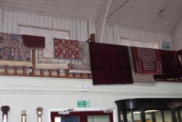 Collection of nine various rugs and prayer mats.