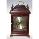 Bracket clock with brass and silvered dial and pineapple finials, 44cm.