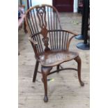 Antique Windsor elm and yew pierced splat back elbow chair.