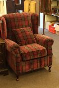 Wing armchair in tartan fabric.