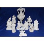 Collection of ten Victorian Parian figures, mostly pastoral subjects and vine encrusted vase (11).