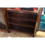 1920's mahogany open bookcase having two adjustable shelves and cabriole legs, 108cm by 119cm.