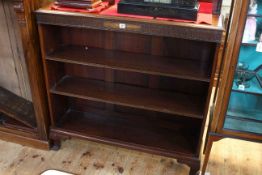 1920's mahogany open bookcase having two adjustable shelves and cabriole legs, 108cm by 119cm.