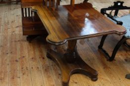 Victorian rosewood occasional table with shaped bow corners on pedestal quadriform base.