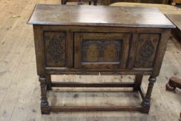 Period style carved jointed oak single door side cabinet on turned legs bearing label for Marsh,