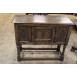 Period style carved jointed oak single door side cabinet on turned legs bearing label for Marsh,