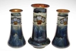 Garniture of three Royal Doulton stoneware vases,