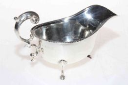 Silver sauce boat with gadroon border and scroll handle, Birmingham 1933.
