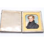 Portrait miniature of young gentleman in travel case with gilt slip, first half 19th Century,