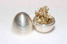 Silver egg opening to reveal silver gilt bouquet by Nicholas Plummer, London.