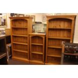 Set of three pine open bookcases, two large and one small (larger pair 184cm by 92cm,