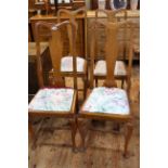 Set of four oak Queen Anne style dining chairs.