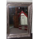 Rectangular silvered framed wall mirror, 116cm by 85cm overall.