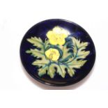 Small Moorcroft dish depicting yellow flowers on blue background, 12cm.