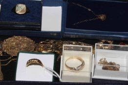 Collection of gold jewellery including rings, necklaces and brooch.