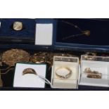 Collection of gold jewellery including rings, necklaces and brooch.