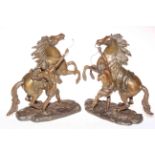 Pair of bronzed models of Marley horses.