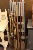 Fishing rods, garden tools, pair steps and tin trunk.