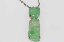 Foliate carved jade pendant in two pieces mounted and with platinum fine chain necklace, boxed.