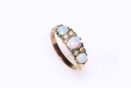 Opal and diamond ring set in 9 carat gold.